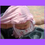 Ava Taking Off Hat.jpg